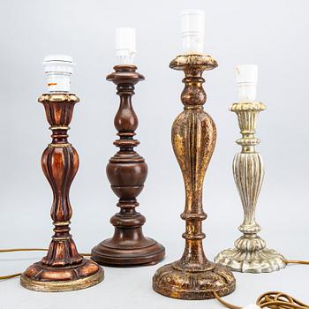 A set of four wood table lamps from Paoletti, Firenze Italy, second half of 20th century.