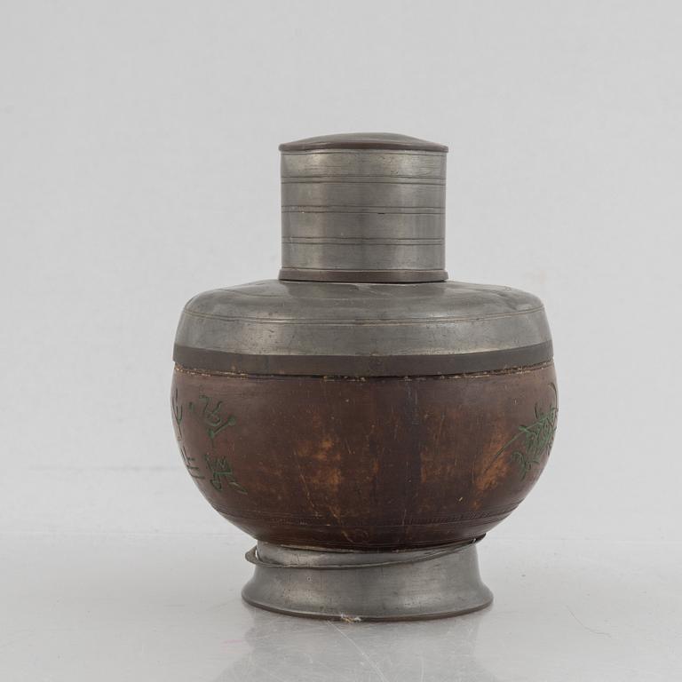 A Chinese pewter and wood tea caddie, early 20th century.
