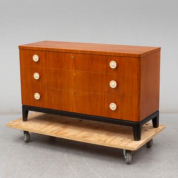 A walnut veneered chest of drawers, 1930's.