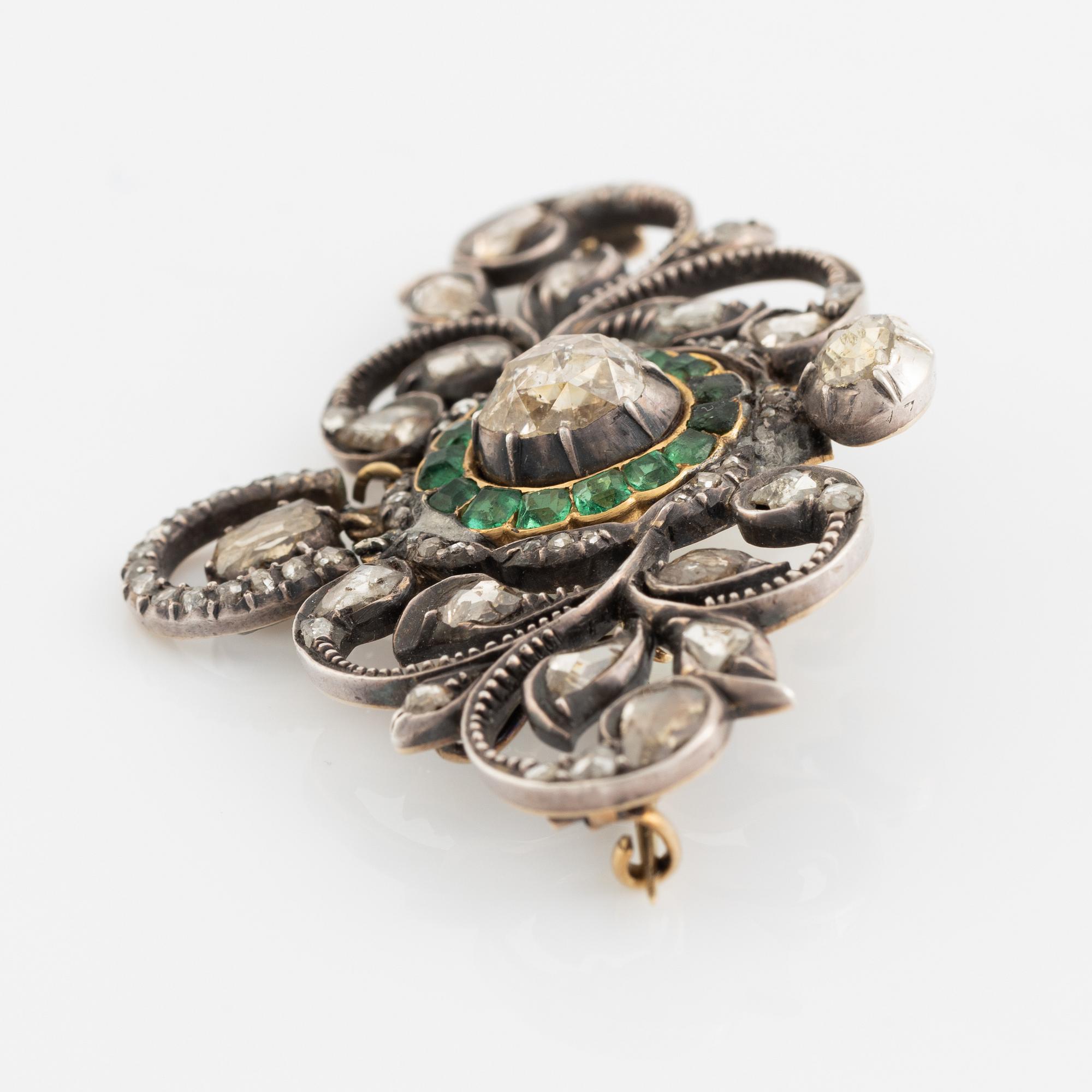 Gold and silver with rose cut diamond and emerald brooch.