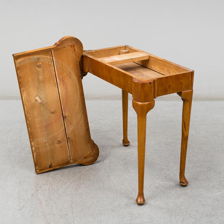 An end of the 19th Century Queen Anne-style card table.