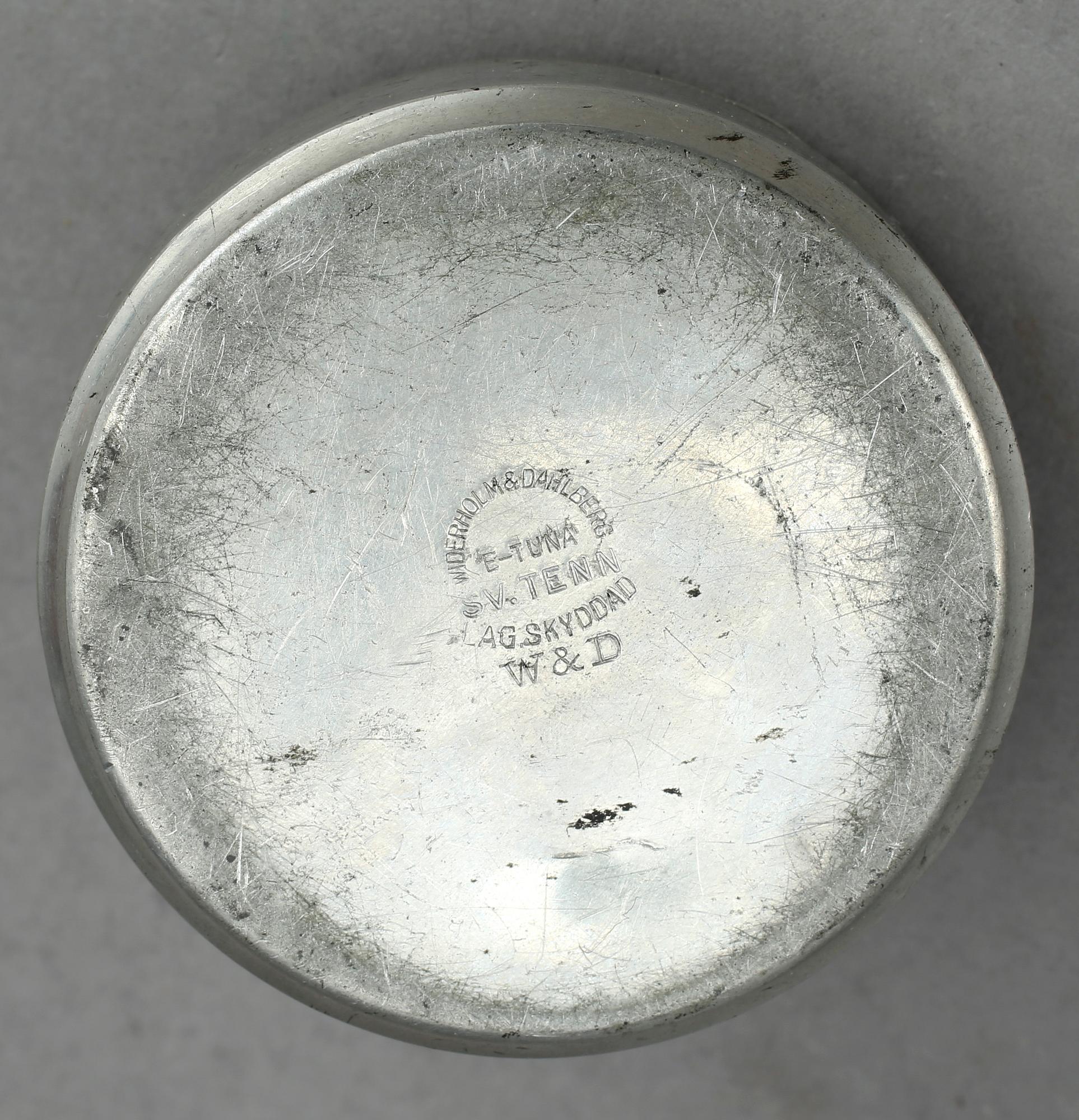 MANSCHETTKNAPPSASK, tenn, "Originell", Widerholm & Dahlberg, Eskilstuna, 1930/40-tal.