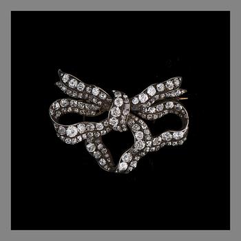 A BROOCH, gold and silver, old cut diamonds. Weight c. 17.8 g.