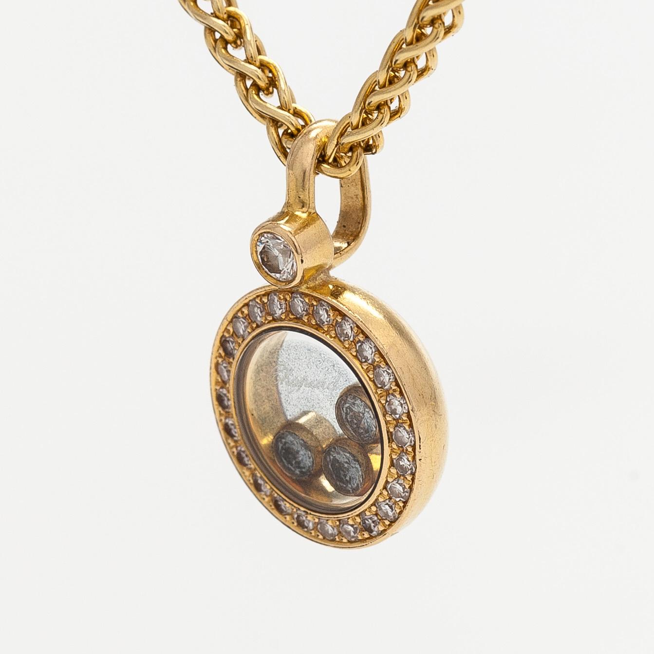 Chopard, an 18K gold 'Happy Diamonds' necklace with brilliant-cut diamonds.