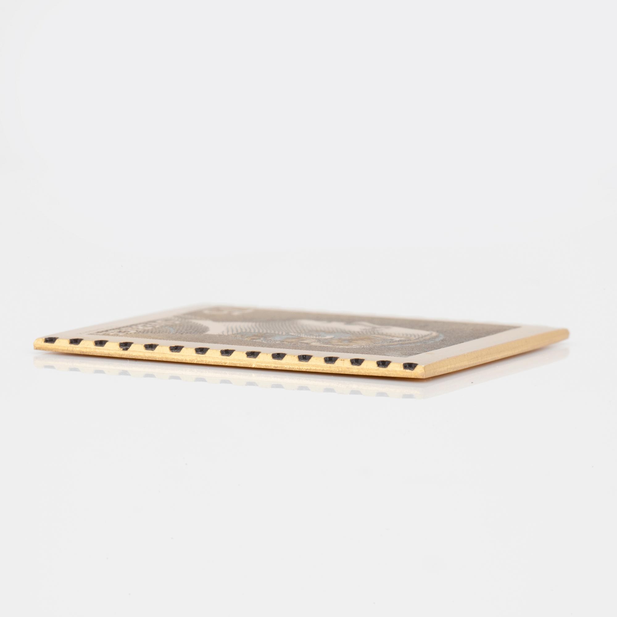 An 18K yellow gold plaque numbered 1074/1985 from 1974. Weight ca 27 grams.