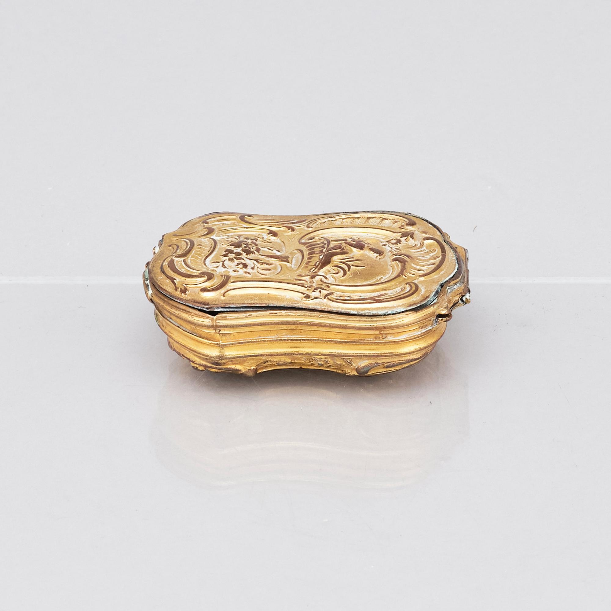 A mid 18th century gilt brass box.