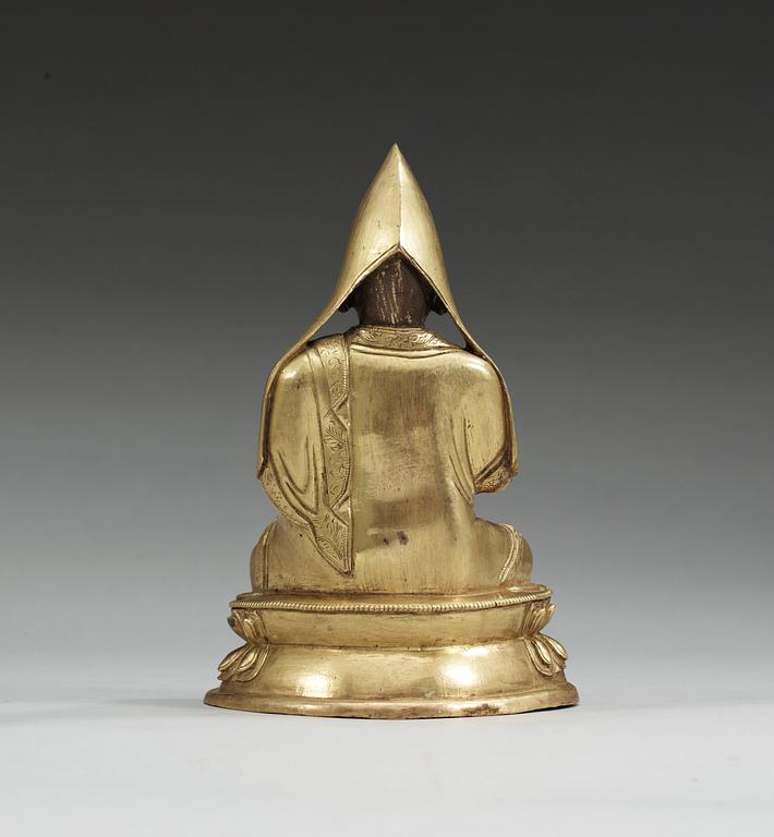 A gilt bronze Tibetan figure of Tsong Kapa, Qing dynasty.
