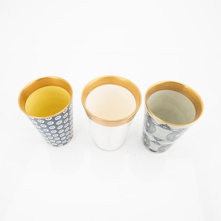 Åsa Lindström,  a set of three signed porcelain mugs.