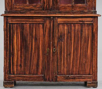 A Swedish faux-boix neo-gothic book cabinet, ca 1830.