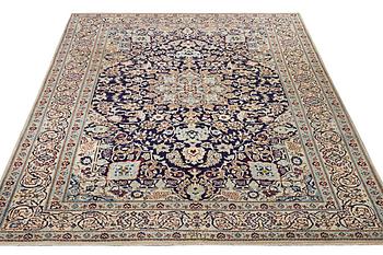 A Nain carpet, part silk, 9 laa, c. 338 x 244 cm.