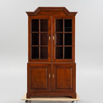 A vitrine cabinet from Åmells, dated 1975.