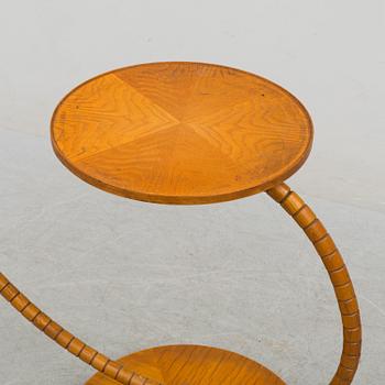 A first half of the 20th century floor lamp with table.