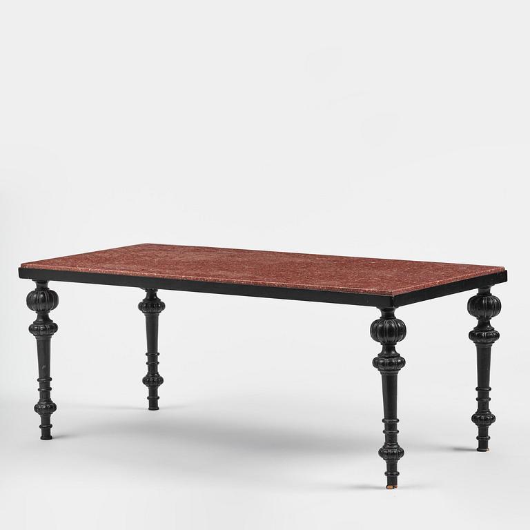 A table with granite stone top from Älvdalen, first part 19th century on a later metal stand.