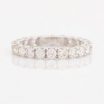 Brilliant-cut diamond eternity ring.