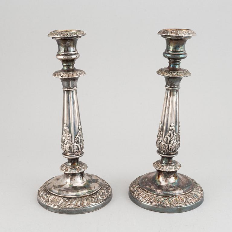 A pair of 19th century white metal candlesticks, unmarked.