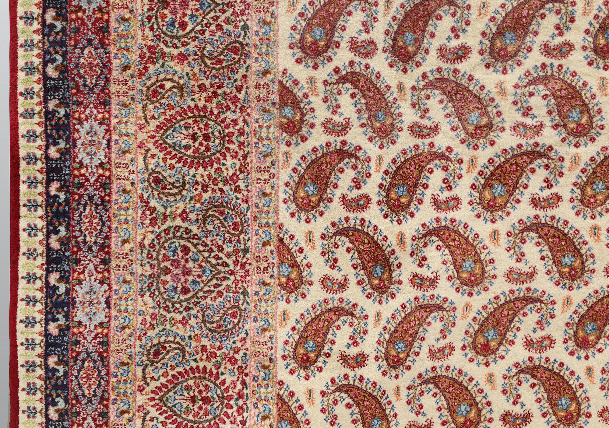 A Kirman carpet, signed, c. 390 x 295 cm.