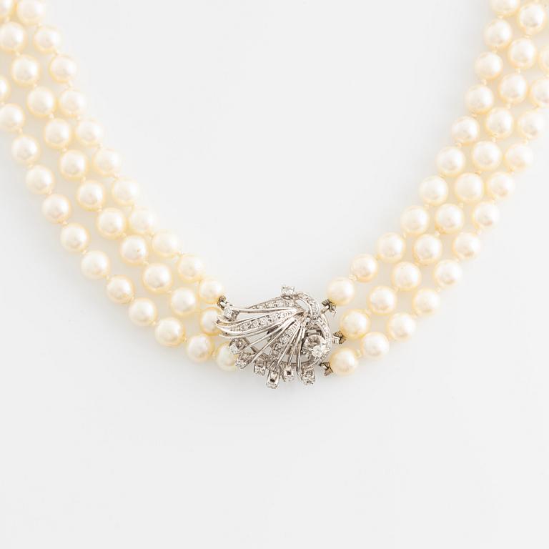 Cultured pearl necklace, three strand, calibrated, clasp with diamonds.
