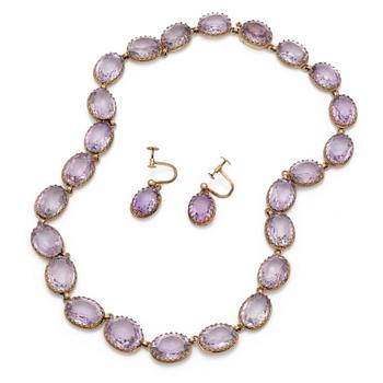 A gilded silver necklace and a pair of earrings set with faceted amethysts.