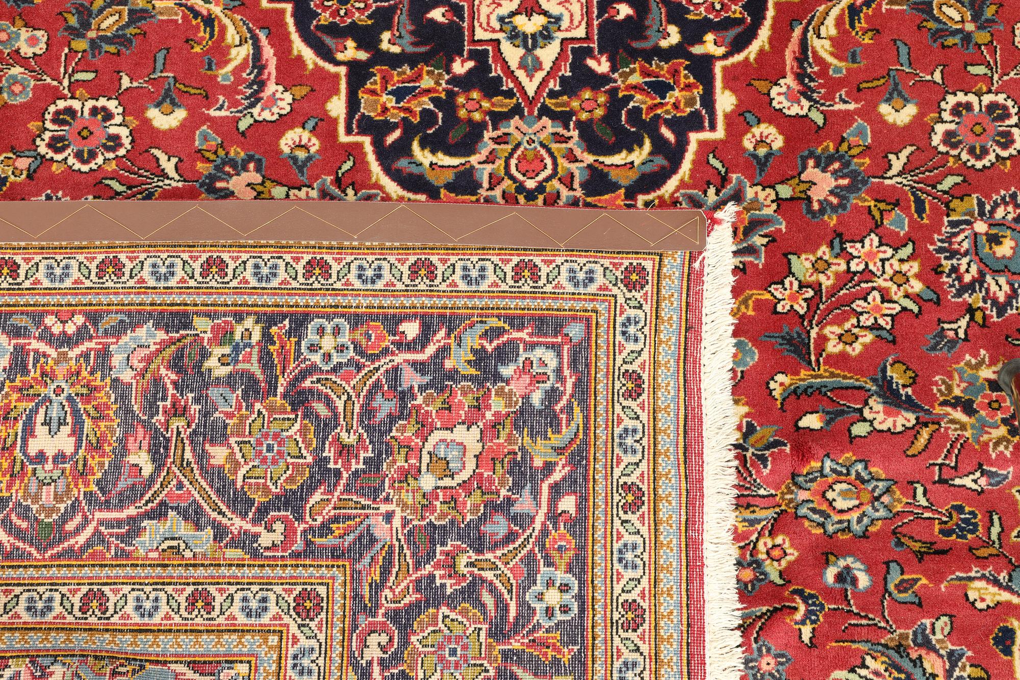 A Keshan rug, approx. 292 x 203 cm.