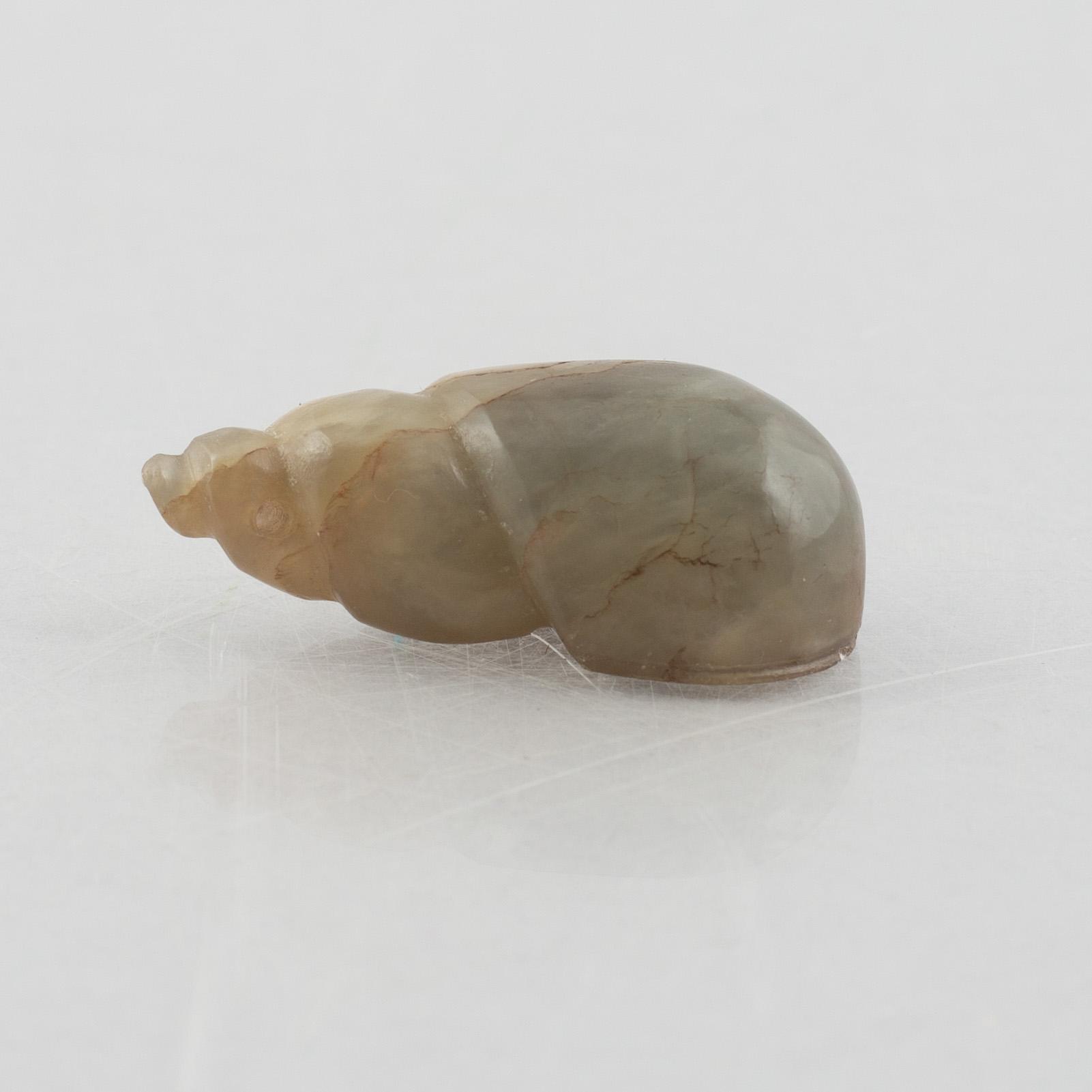 A group of three Chinese stone charms, 20th century.