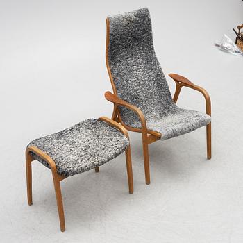 Yngve Ekström, an armchair and a footstool "Lamino", anniversary edition, Swedese.