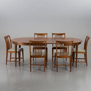 A Svante Skogh walnut dining table and 6 chairs with two extra leafs.