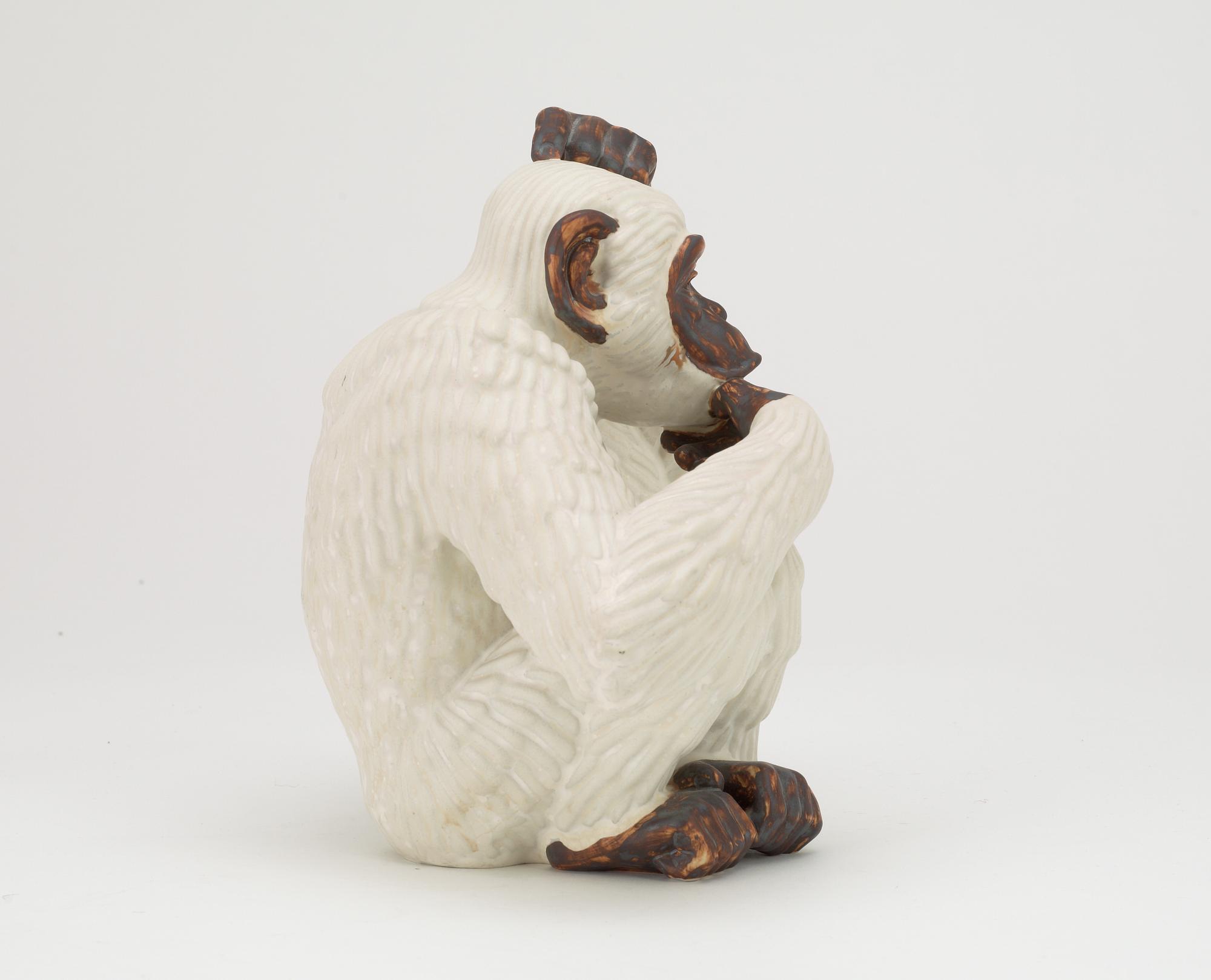 A Gunnar Nylund stoneware figure of a chimpanzee, Rörstrand.