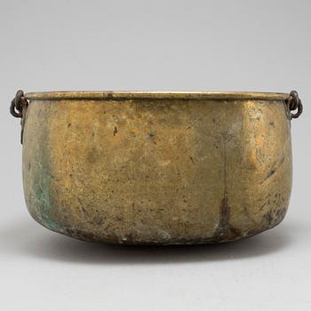 An 18th century brass cauldron.