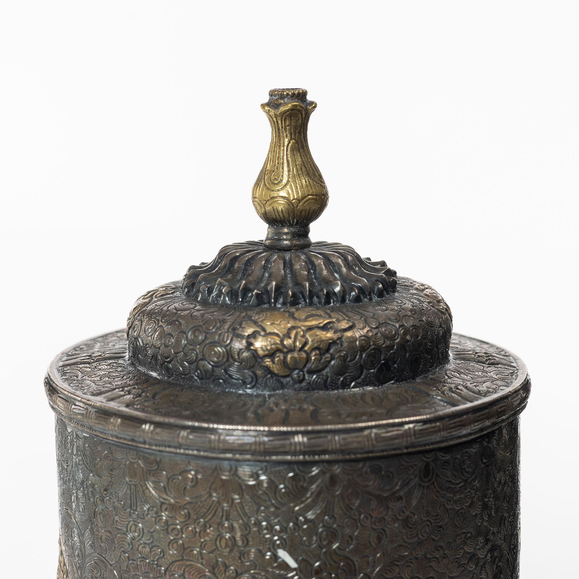 A silvered brass prayer container, Tibet, 20th century.