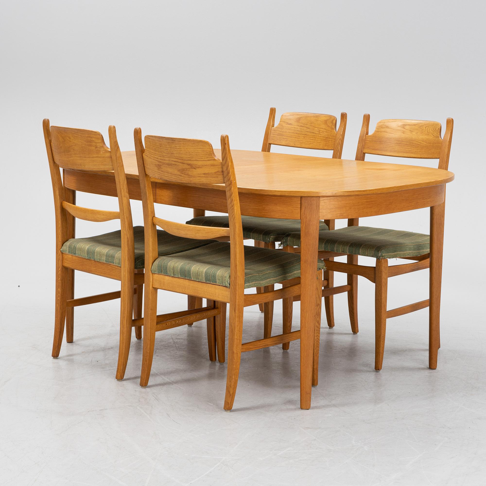 Carl Malmsten, a dining table and four chairs, 'Calmare nyckel', Åfors Möbelfabrik, second half of the 20th century.