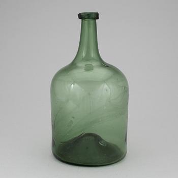 A 18th or 19th century glass bottle.