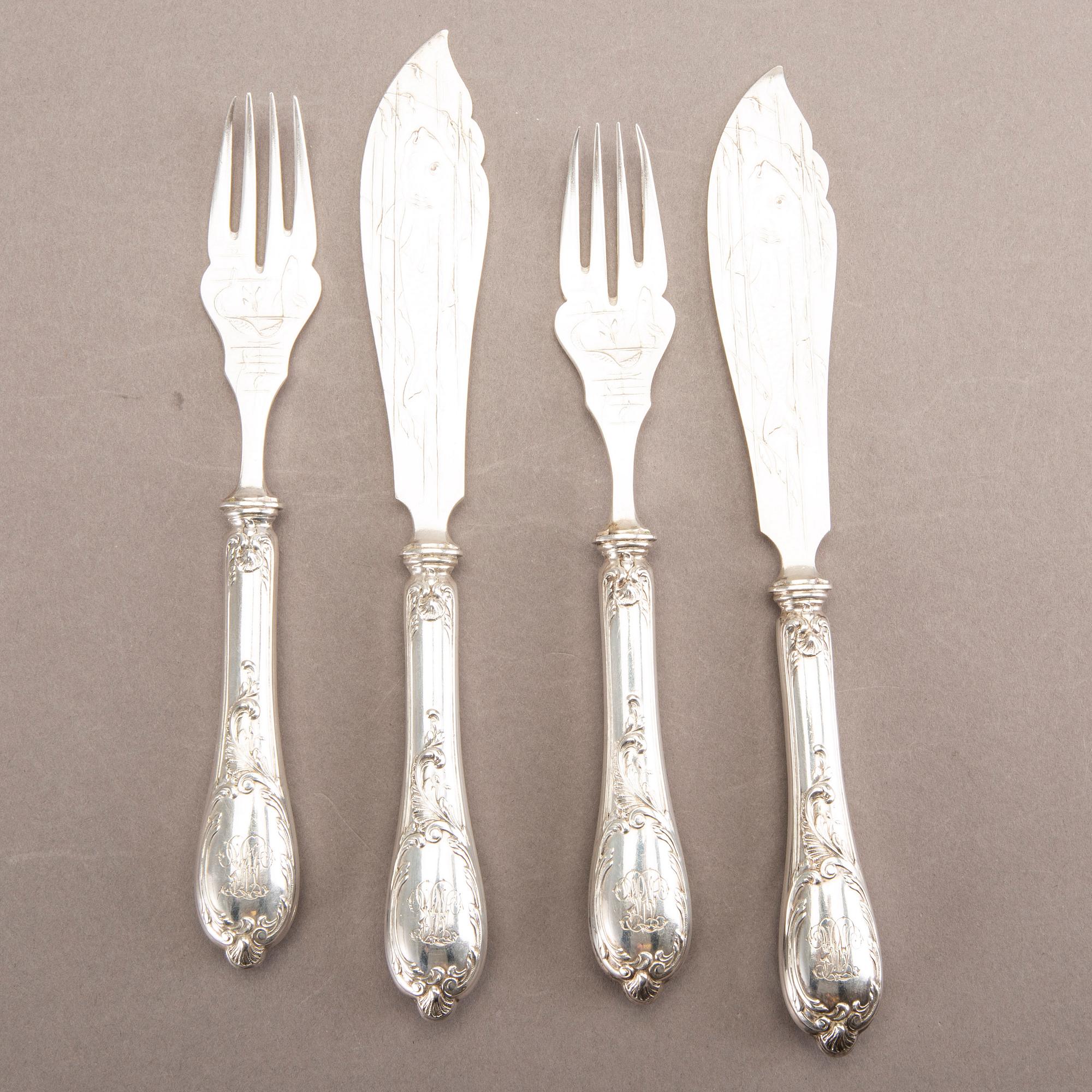 A German 20th century set of 12 fish cutlery low grade silver mark of F W Hespe hamburg early 1900s.