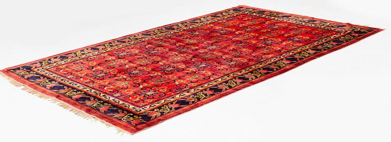 An East Turkestan silk carpet, ca 308 x 182 cm.