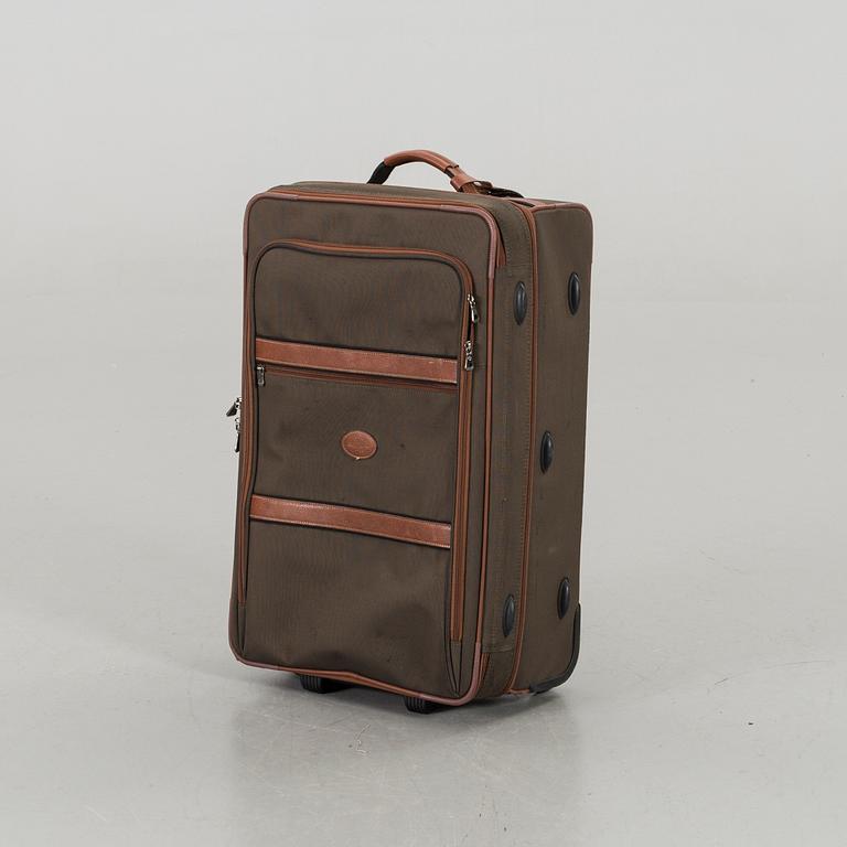 A LONGCHAMP SUITCASE.