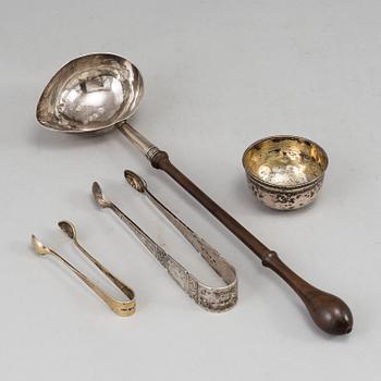 An English 18th century silver ladle, a silver tumbler and two silver sugar-tongs.