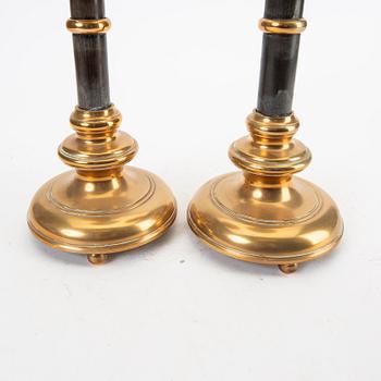 A pair of brass and wood candle sticks early 1900s.