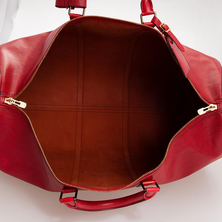 A RED EPI LEATHER KEEPALL TRAVEL BAG.