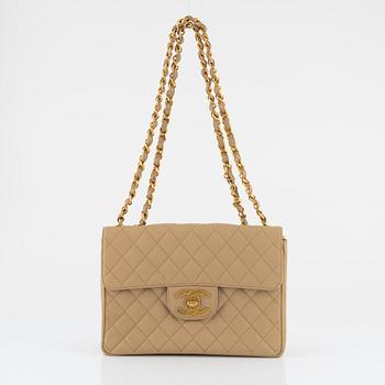 Chanel, a beige 'Caviar Jumbo Classic Flap Bag', vintage.