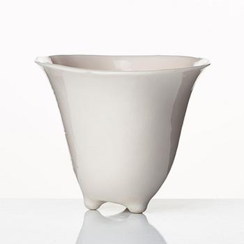 A rhinoserous shaped blanc de chine libation cup, Qing dynasty.