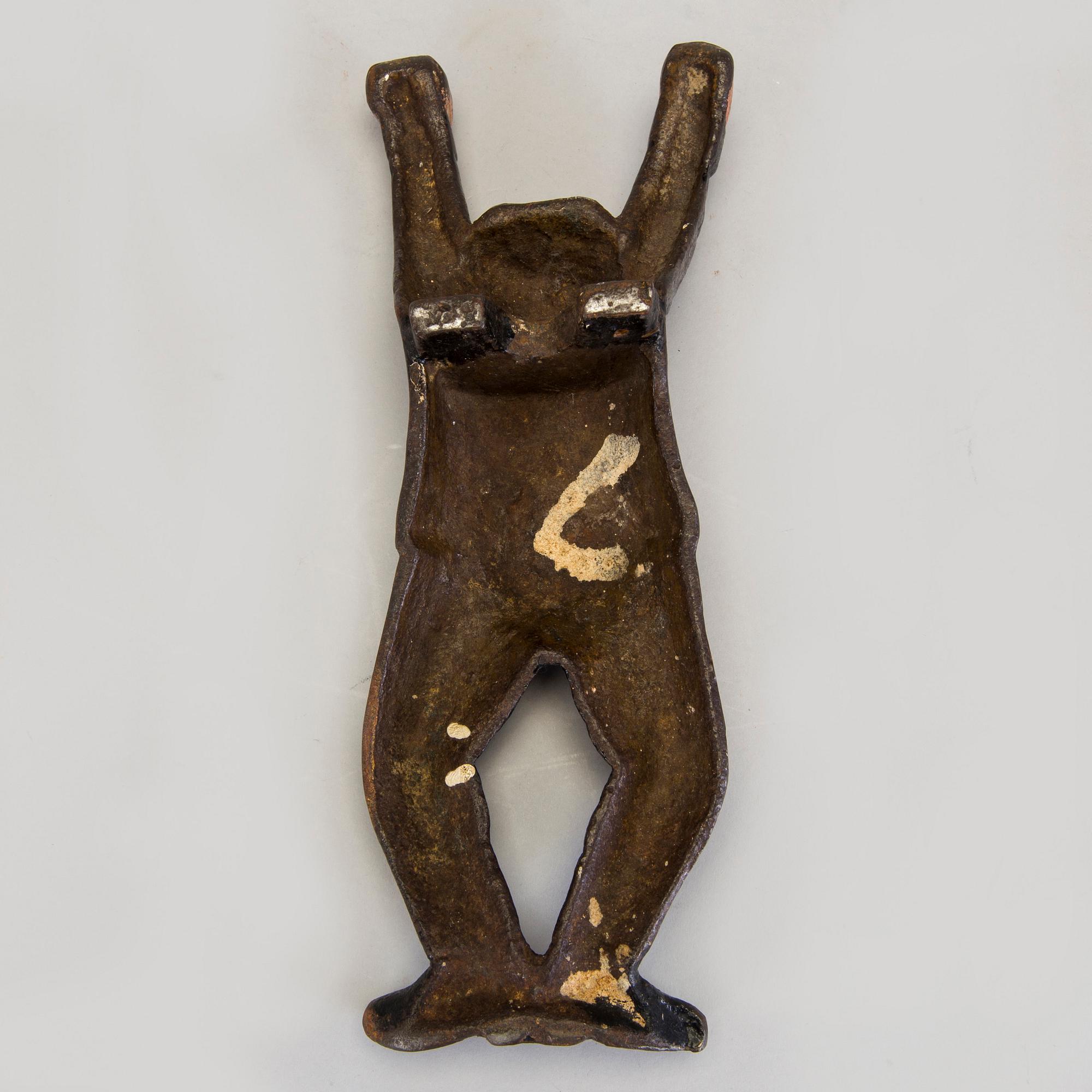 A cast iron boot jack by Bolinder, Stockholm, around 1900.