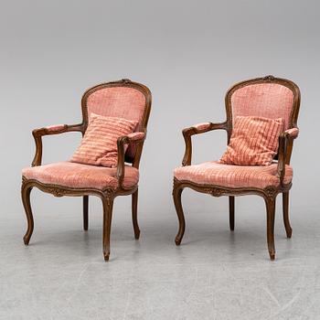A pair of 19th-century rococo revival arm-chairs.