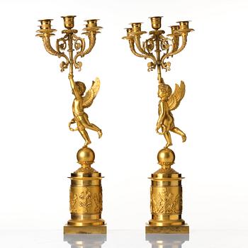 A pair of Empire five lights candelabra.