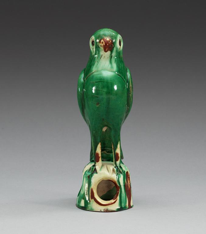 A green glazed figure of a falcon, Qing dynasty.