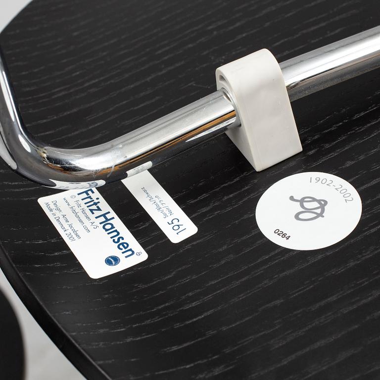 An Arne Jacobsen "Centenary Package" comprising three "Ant Chairs" and an eggshaped table, Fritz Hansen, Denmark.