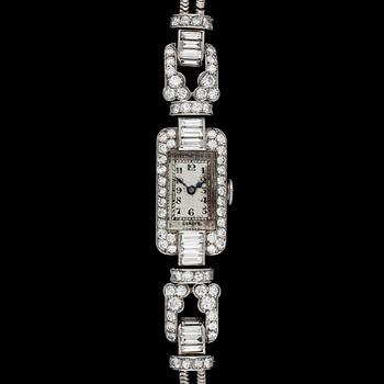 1419. A diamond ladie's wrist watch, tot. app. 4 cts.