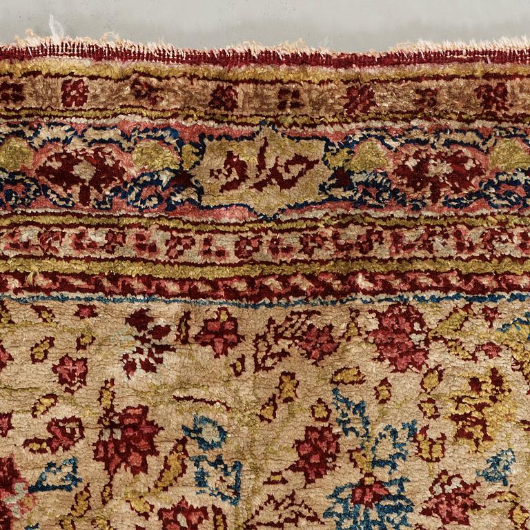 A CARPET, a semi-antique silk Tabriz figural, signed Haddad, 180,5 x 123,5 cm.