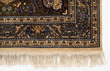 A Tabriz rug, a. 214 x 137 cm.