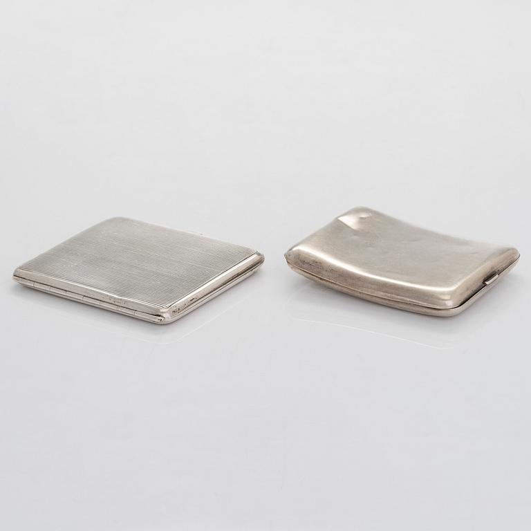 Two silver cigarette cases, J. H. Werner, Berlin, 1922, and Huguenin Frères, Switzerland before 1933.