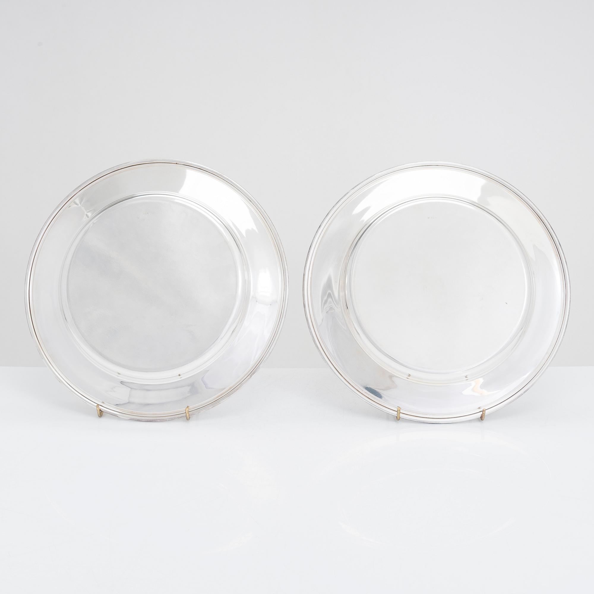 A 12-piece set of silver chargers, makers' marks of Hugo Grün, S.H. Jörgensen..., Denmark, around mid-20th century.