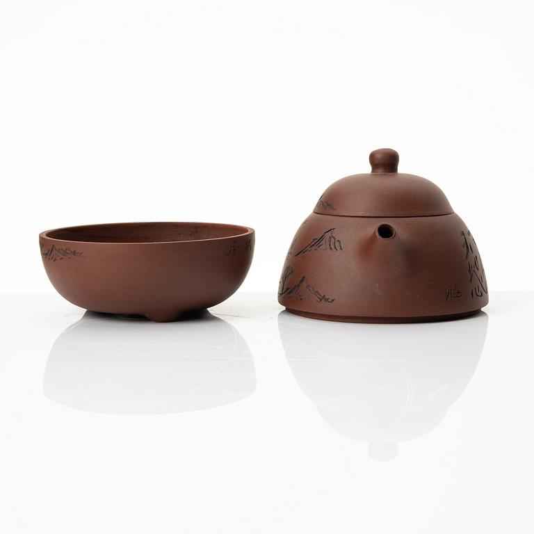 Wu Quan Xiang, A Chinese yixing teapot and a bowl with sieve and four cups, 1980s.